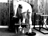 Lever Standing Leg Curl (on leg extension)